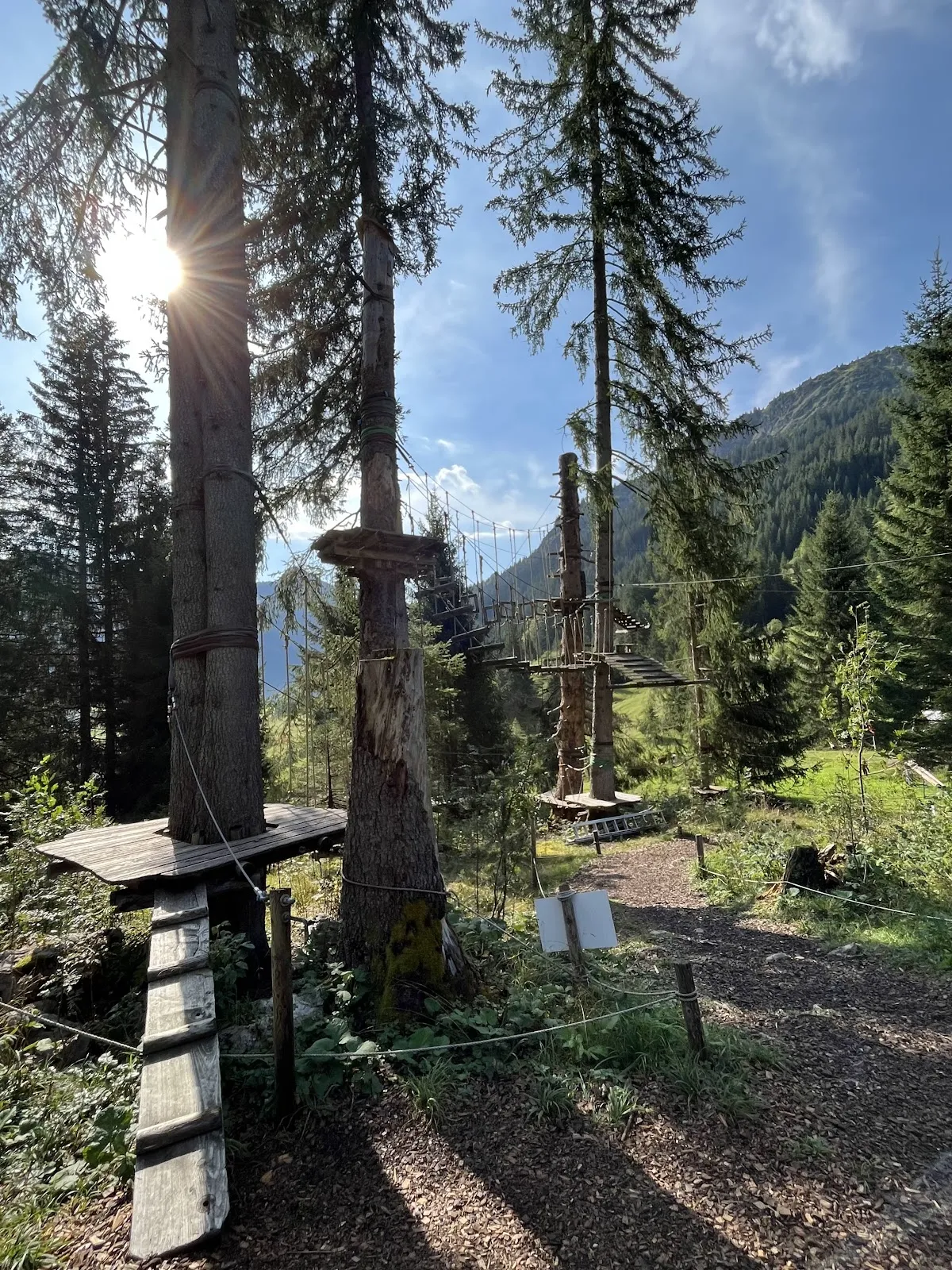 Rider launching on the Flying Fox zipline with Rote Flüh mountain in background