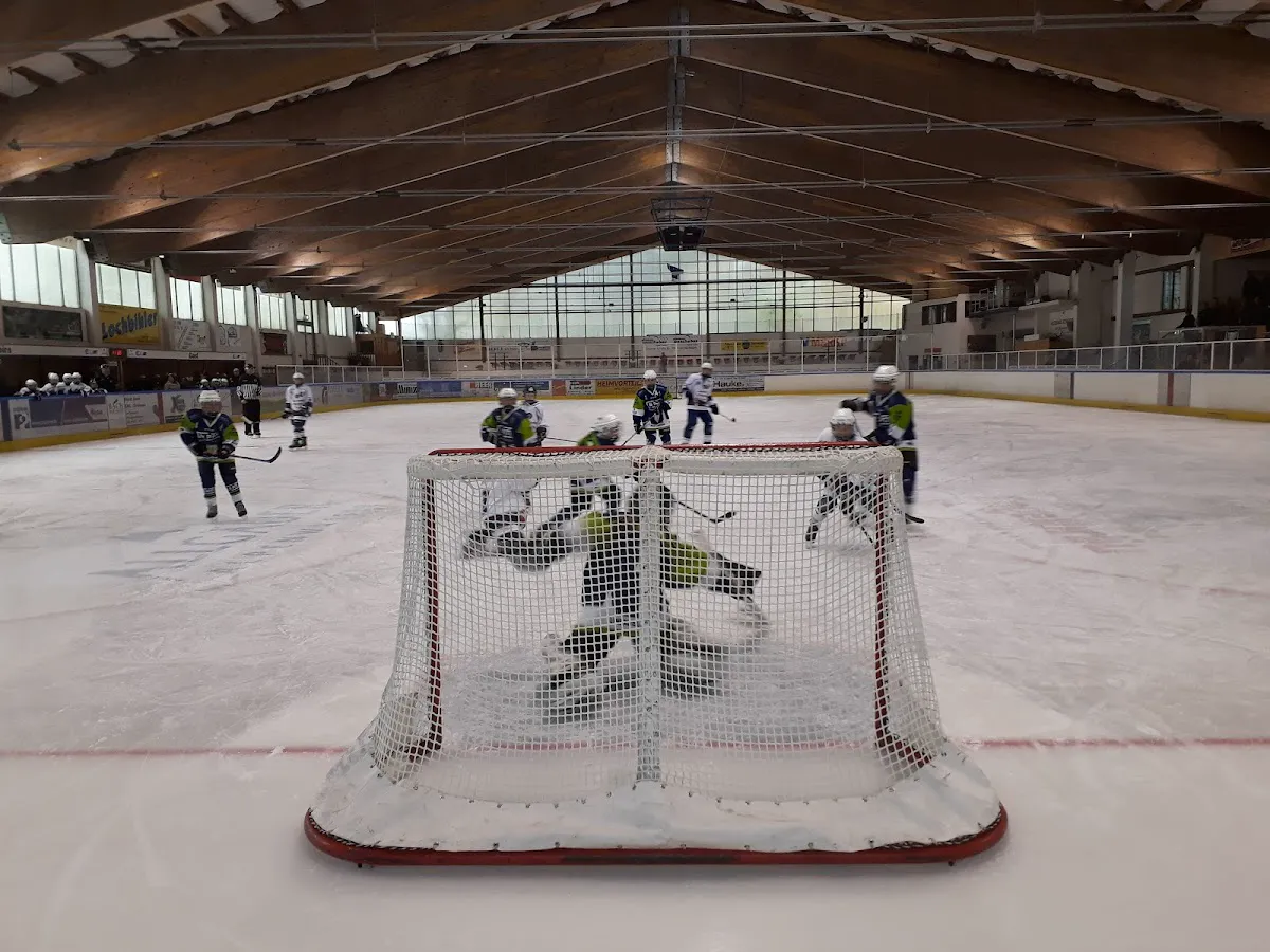 Evening ice skating on Haldensee with floodlights illuminating the ice