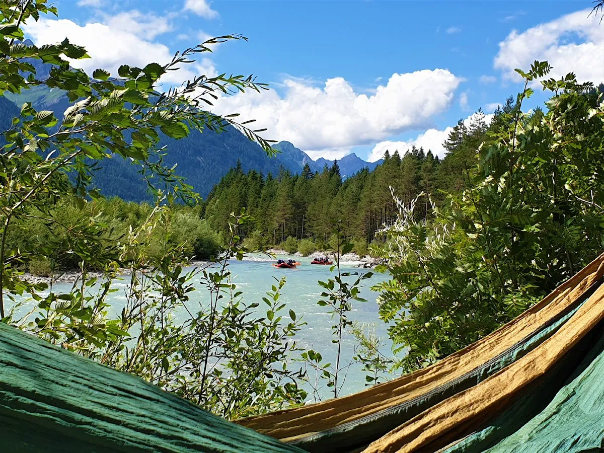 Canadian mini-raft navigating turquoise glacial waters of the Lech River