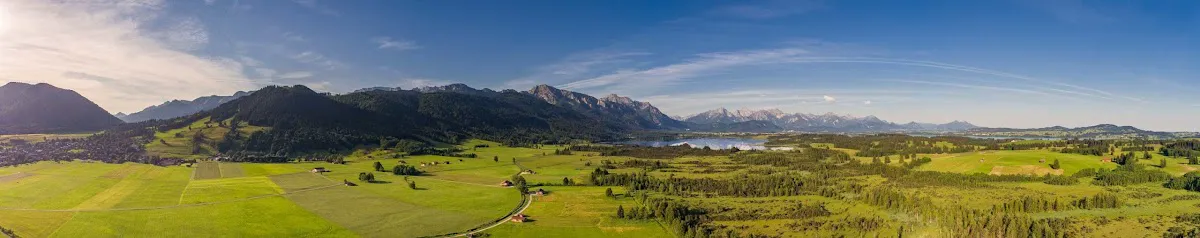 Tobogganers descending floodlit run at Ehrwalder Alm at night