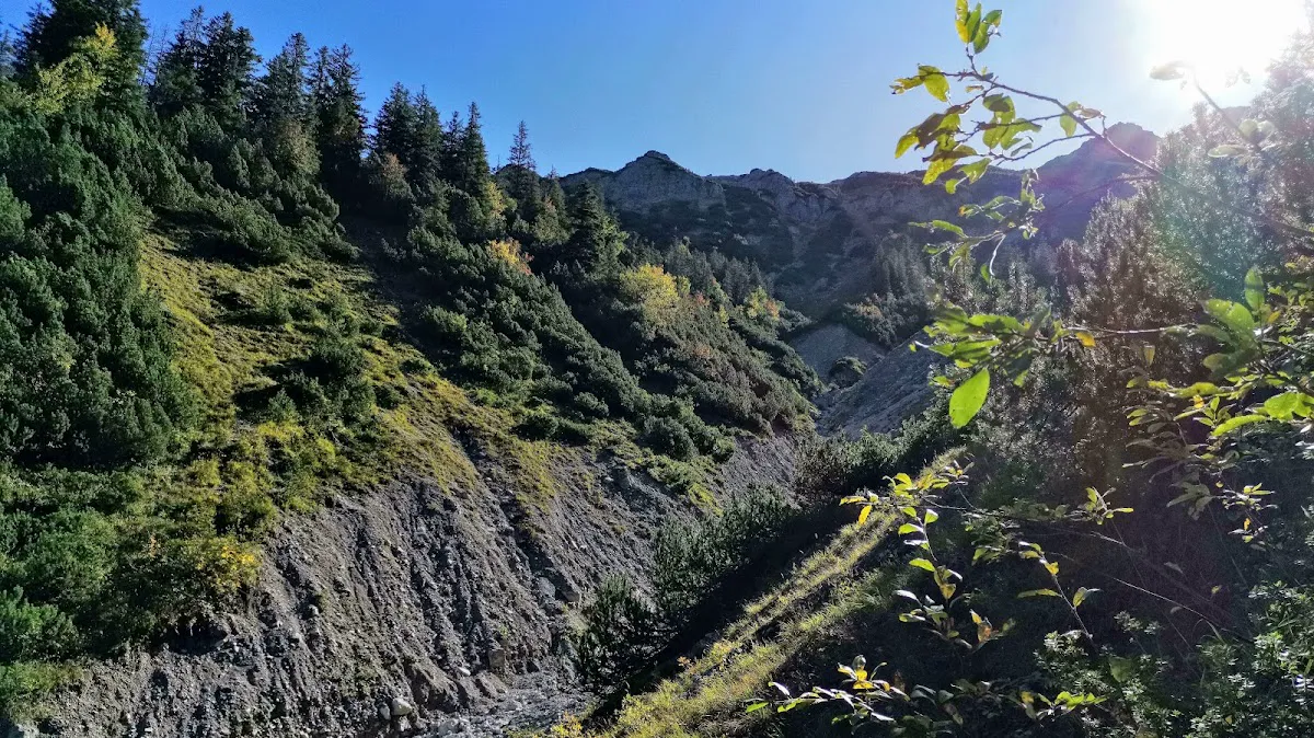 Historical border stone on Schmugglersteig marking Austria-Bavaria boundary