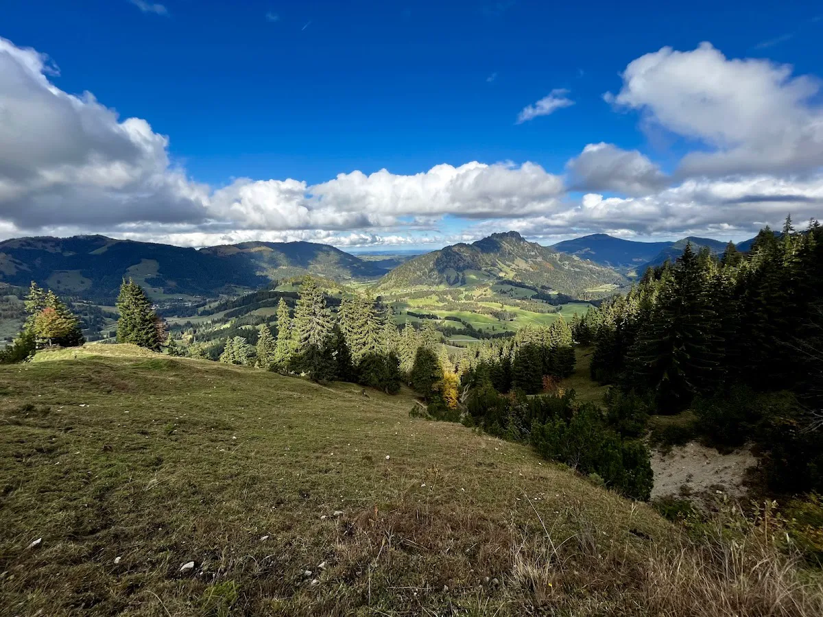 Iseler Summit Cross with dramatic mountain backdrop