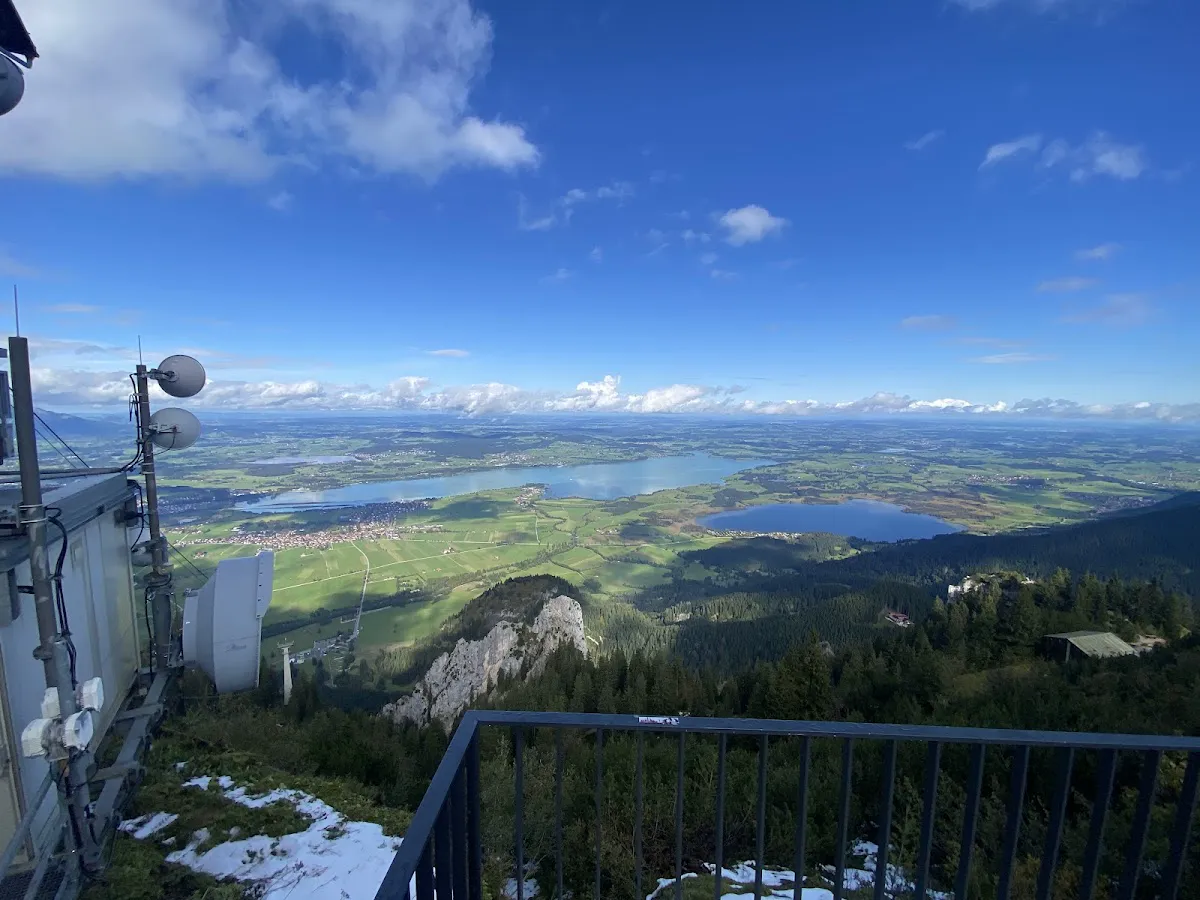 Neuschwanstein Castle view from Tegelberg ski route with Alpsee lake below